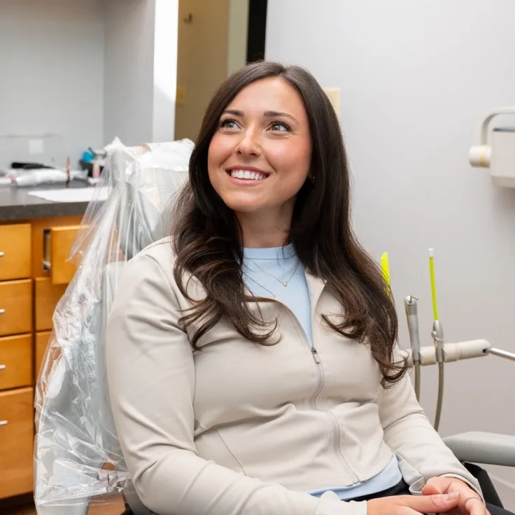 Smiling patient relaxing in the dental chair at Lumon Dental